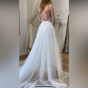 Beautiful whimsical wedding dress. Lace detailing in the bust, tulle skirt.